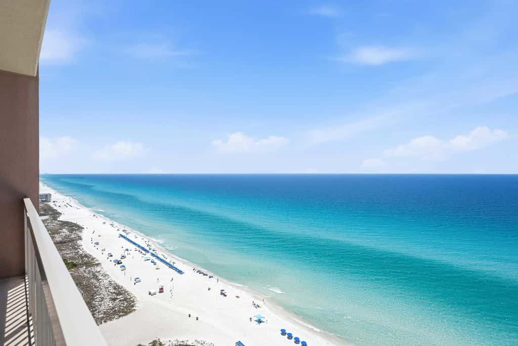 Elegant, beachfront condo with a furnished balcony, views & two pools