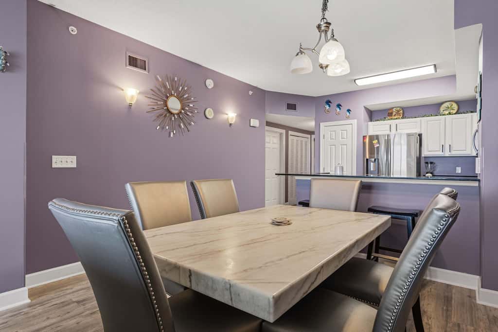 Elegant, beachfront condo with a furnished balcony, views & two pools