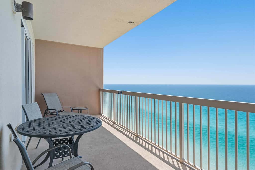 Elegant, beachfront condo with a furnished balcony, views & two pools