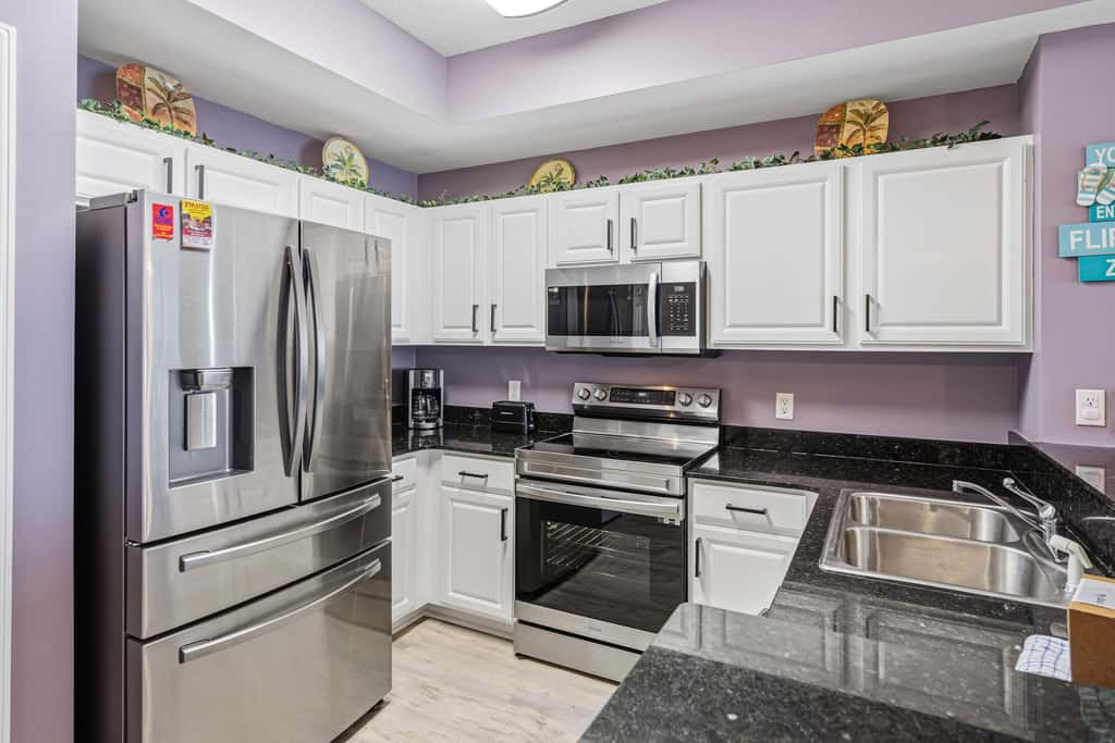 Elegant, beachfront condo with a furnished balcony, views & two pools