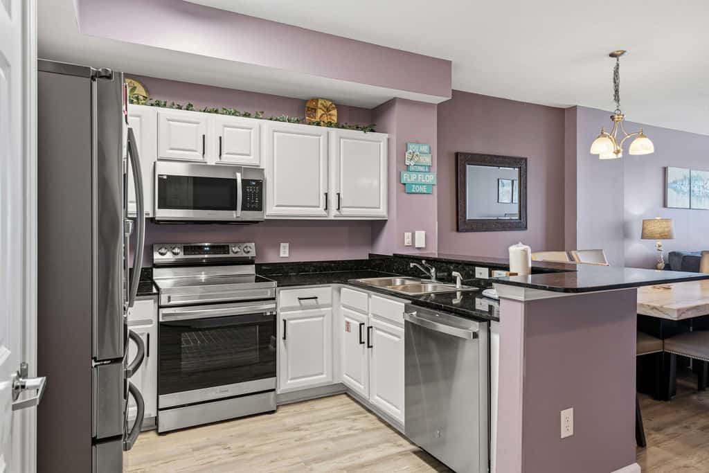 Elegant, beachfront condo with a furnished balcony, views & two pools