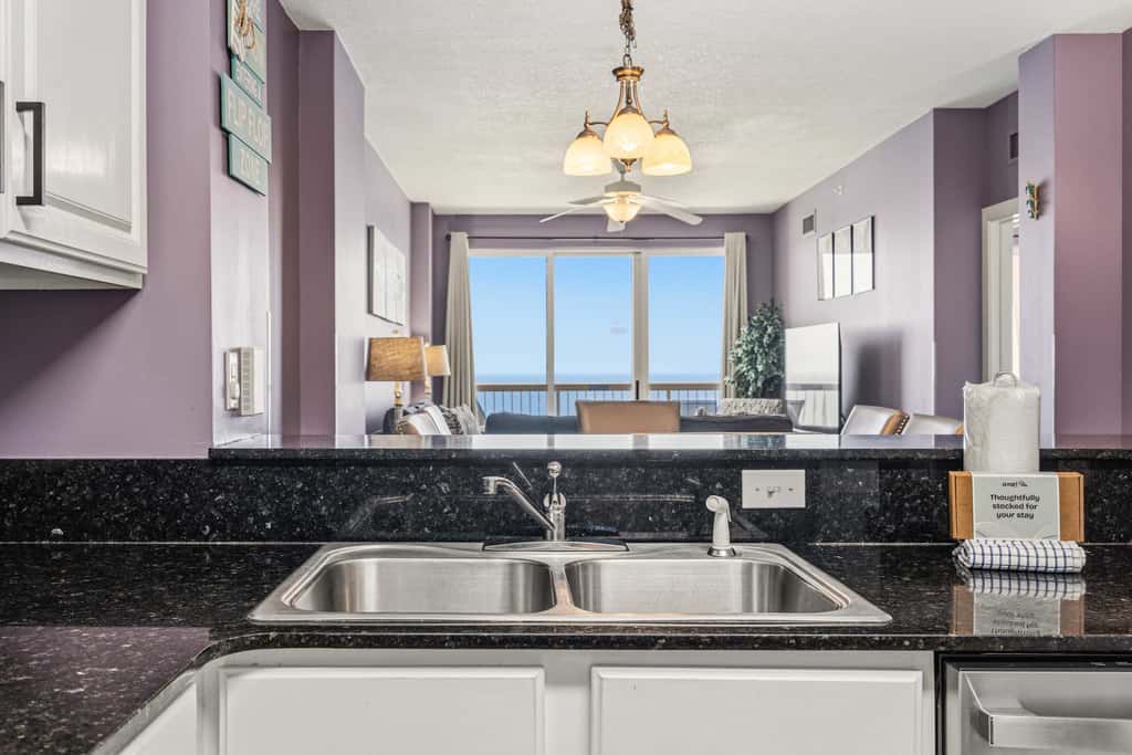 Elegant, beachfront condo with a furnished balcony, views & two pools