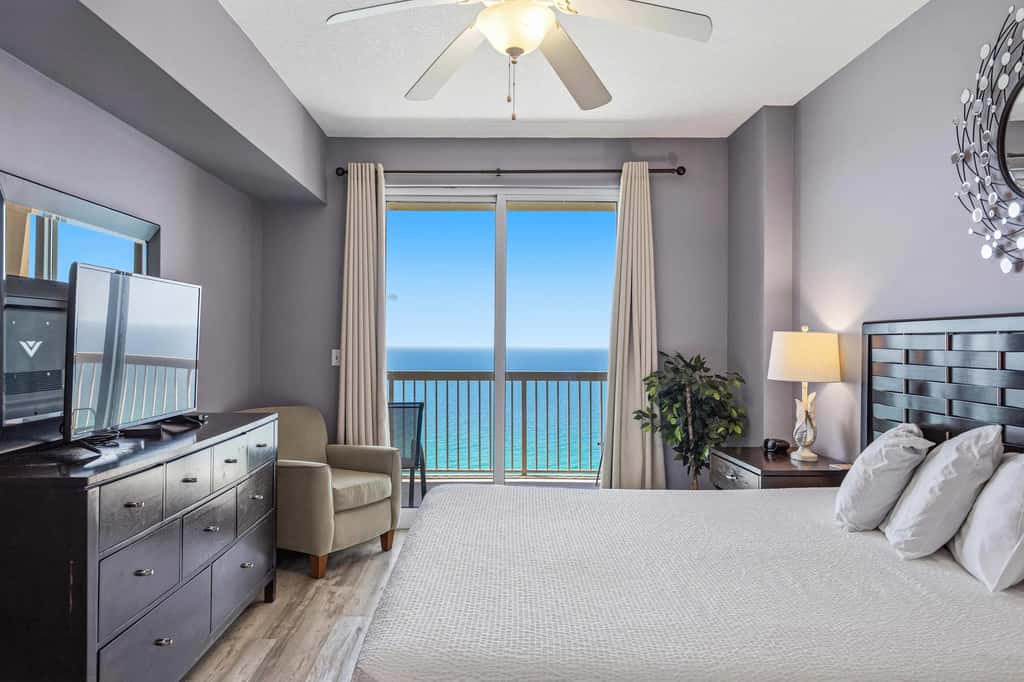 Elegant, beachfront condo with a furnished balcony, views & two pools