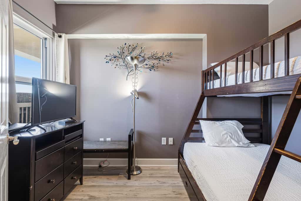 Elegant, beachfront condo with a furnished balcony, views & two pools