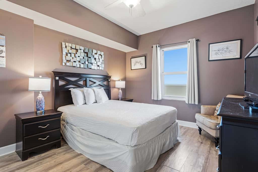 Elegant, beachfront condo with a furnished balcony, views & two pools