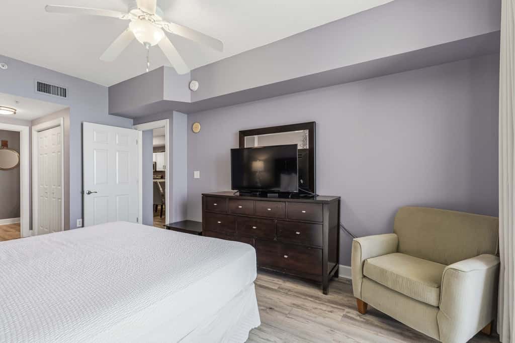 Elegant, beachfront condo with a furnished balcony, views & two pools