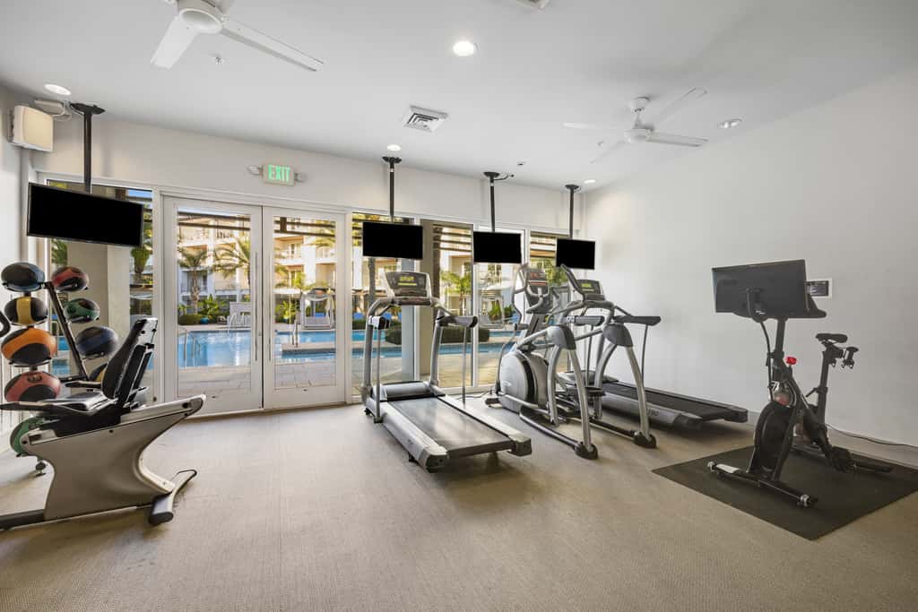 Third-floor luxury condo near beach with resort pool, gym & EV chargers