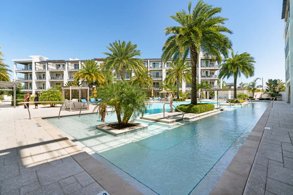 Third-floor luxury condo near beach with resort pool, gym & EV chargers