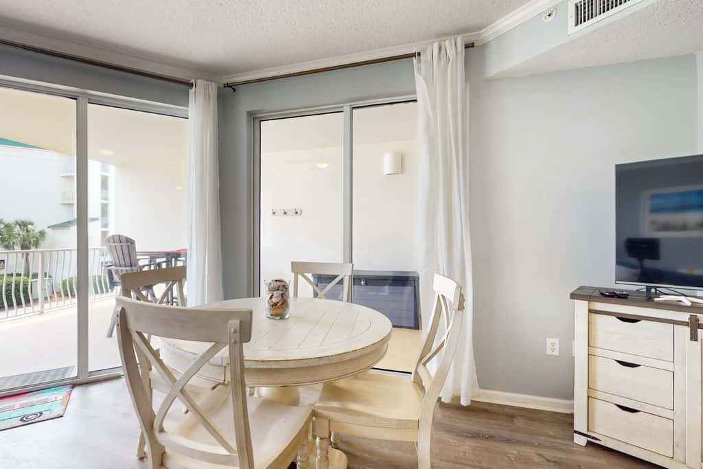 Attractive home with spacious balcony, pool view & pickleball - near beach