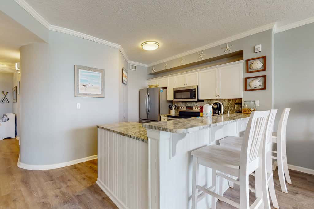 Attractive home with spacious balcony, pool view & pickleball - near beach