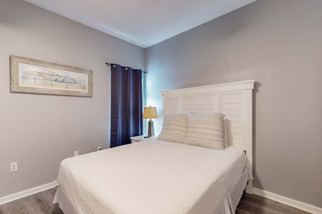 Attractive home with spacious balcony, pool view & pickleball - near beach