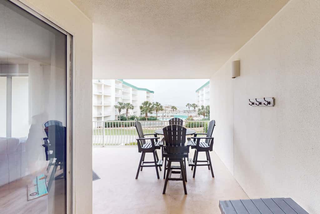 Attractive home with spacious balcony, pool view & pickleball - near beach
