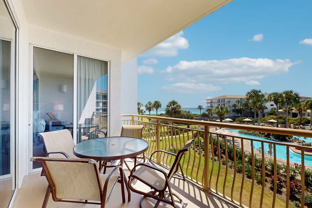 Airy beachfront condo with balcony views, lagoon pool, tennis & pickleball
