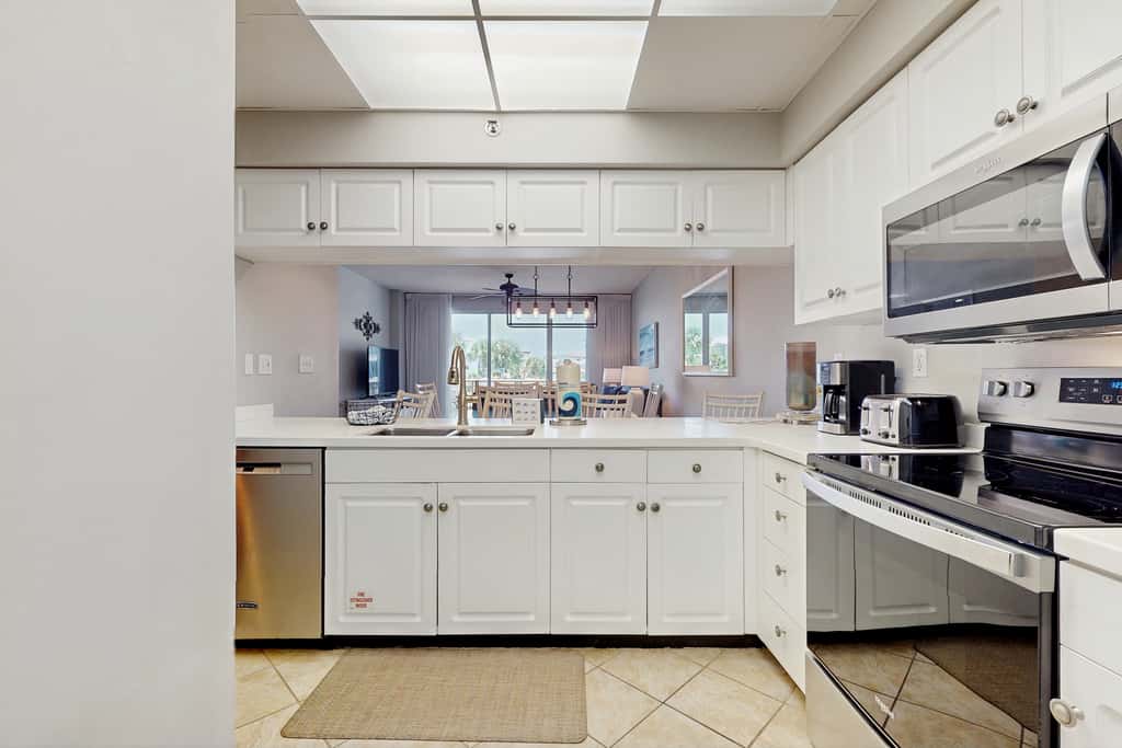 Airy beachfront condo with balcony views, lagoon pool, tennis & pickleball