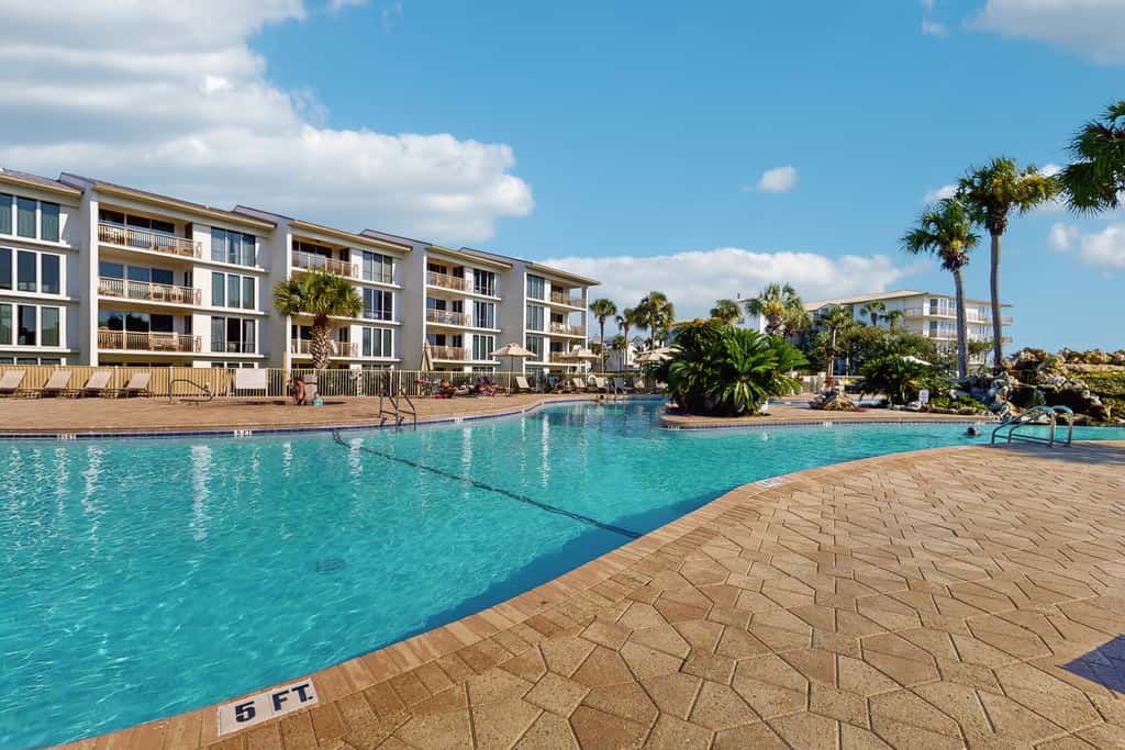 Airy beachfront condo with balcony views, lagoon pool, tennis & pickleball