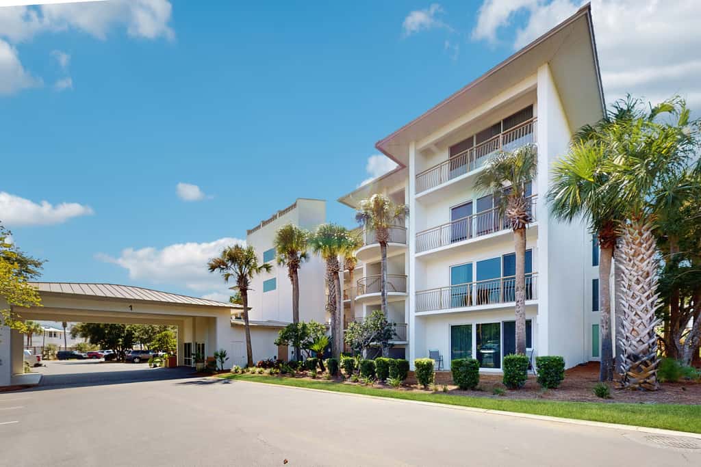 Airy beachfront condo with balcony views, lagoon pool, tennis & pickleball