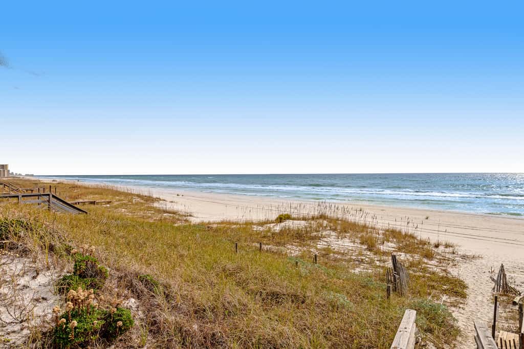 Gulf-front house near golf with pool, ocean views, beach access, & balcony