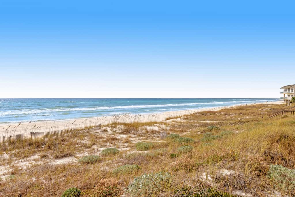 Gulf-front house near golf with pool, ocean views, beach access, & balcony