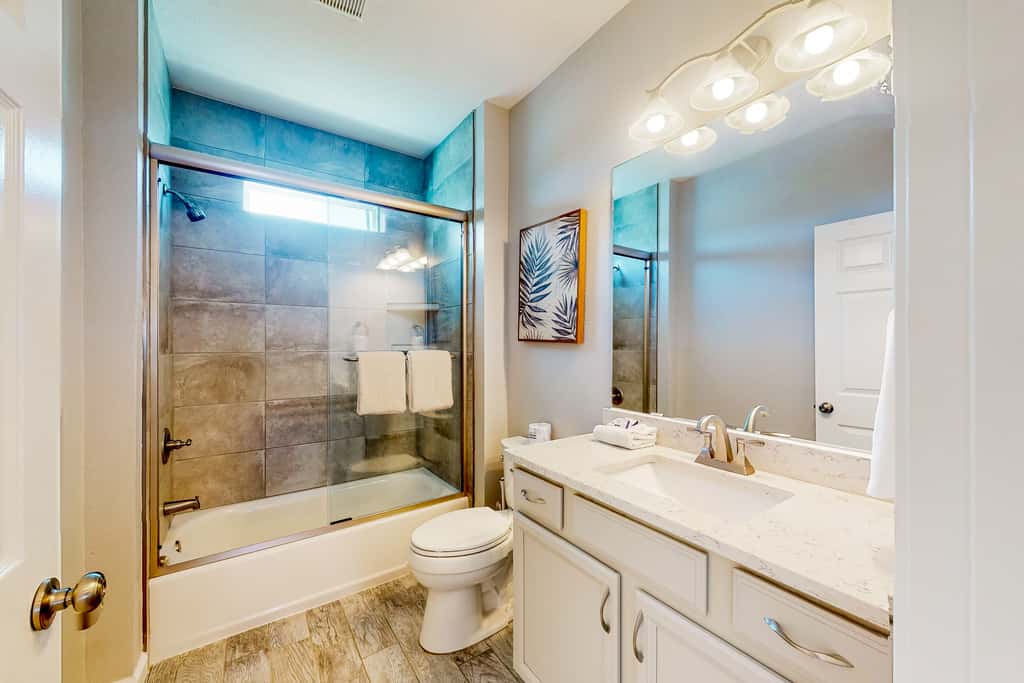 Coastal dog-friendly cottage with pool access, grill, board games, W/D, & AC