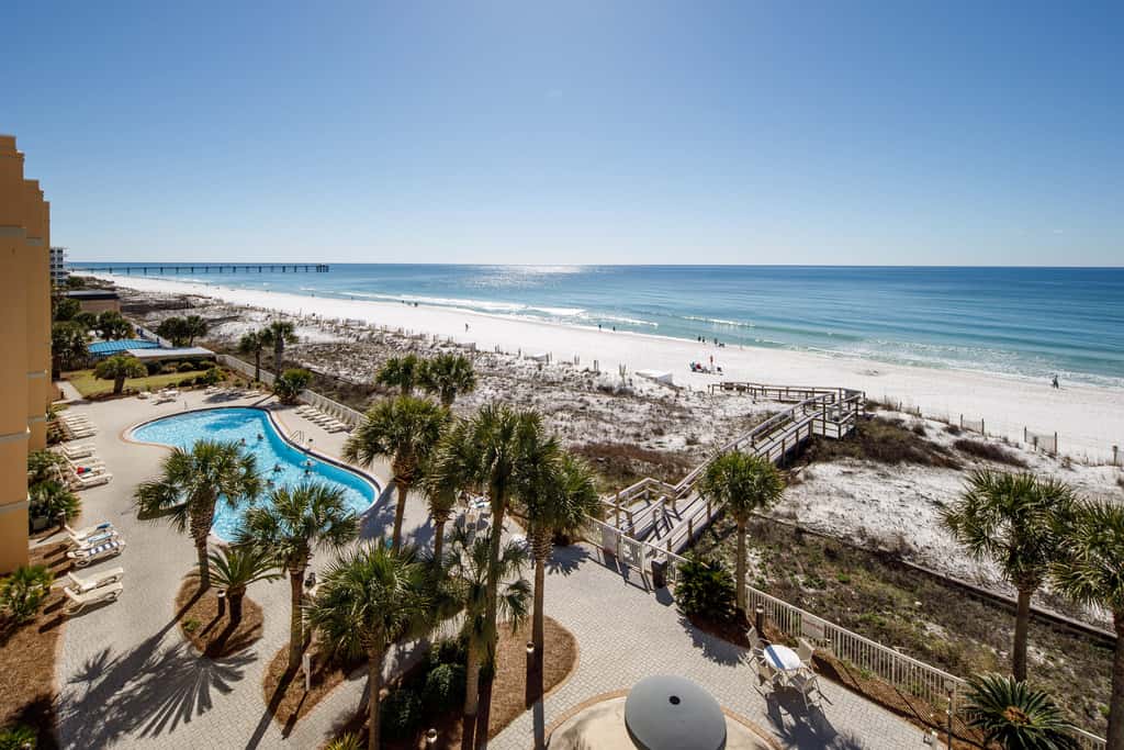 Gulf-view condo with beachfront access, pool, hot tub, gym, AC, & washer&dryer