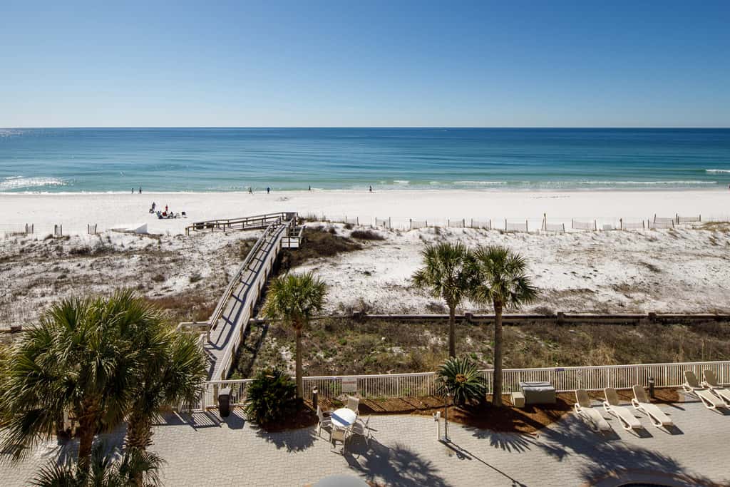 Gulf-view condo with beachfront access, pool, hot tub, gym, AC, & washer&dryer