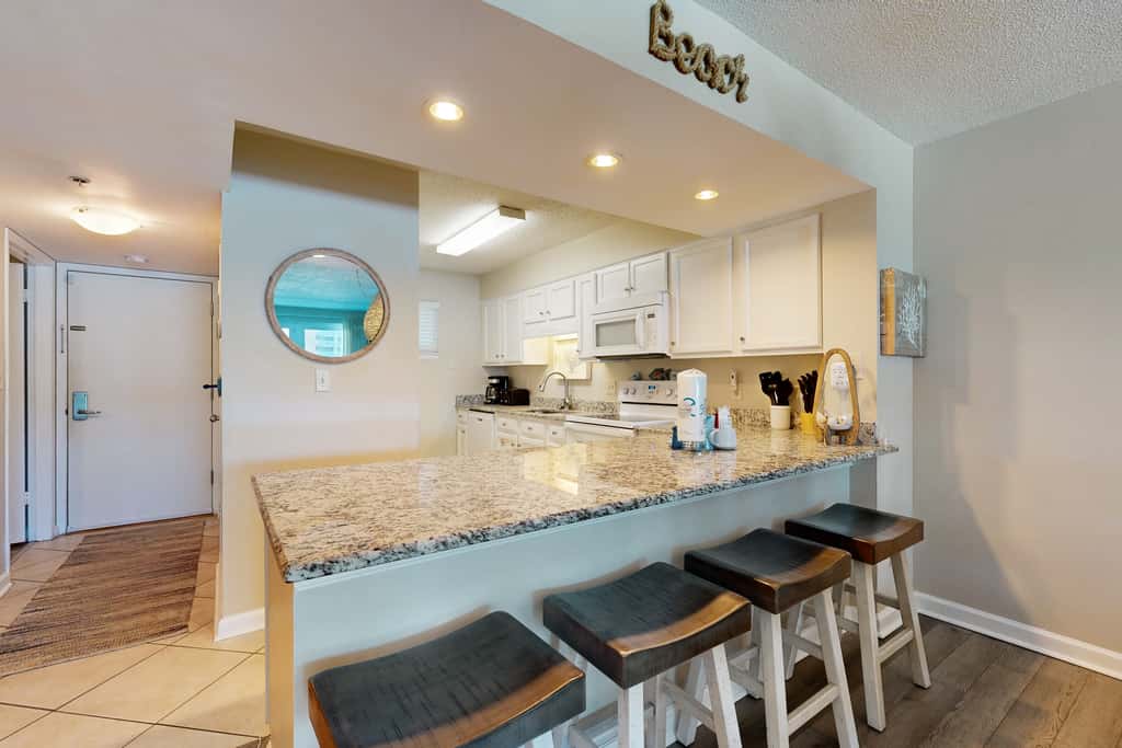 Beachfront condo with Gulf views, beach access, pool, & private balcony