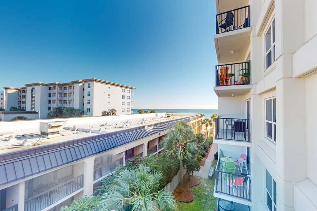 Beachfront condo with Gulf views, beach access, pool, & private balcony