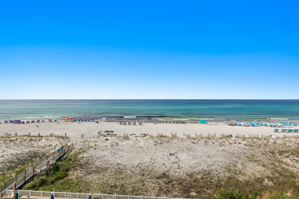 Beachfront condo with Gulf views, beach access, pool, & private balcony