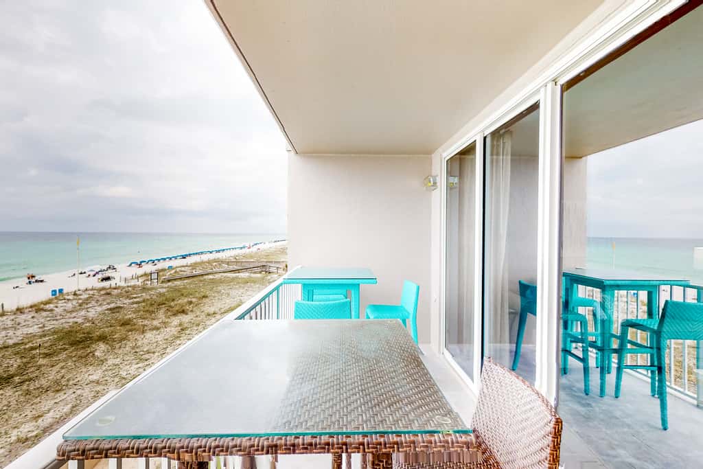 Beachfront condo with pool, hot tub, gym access, balcony