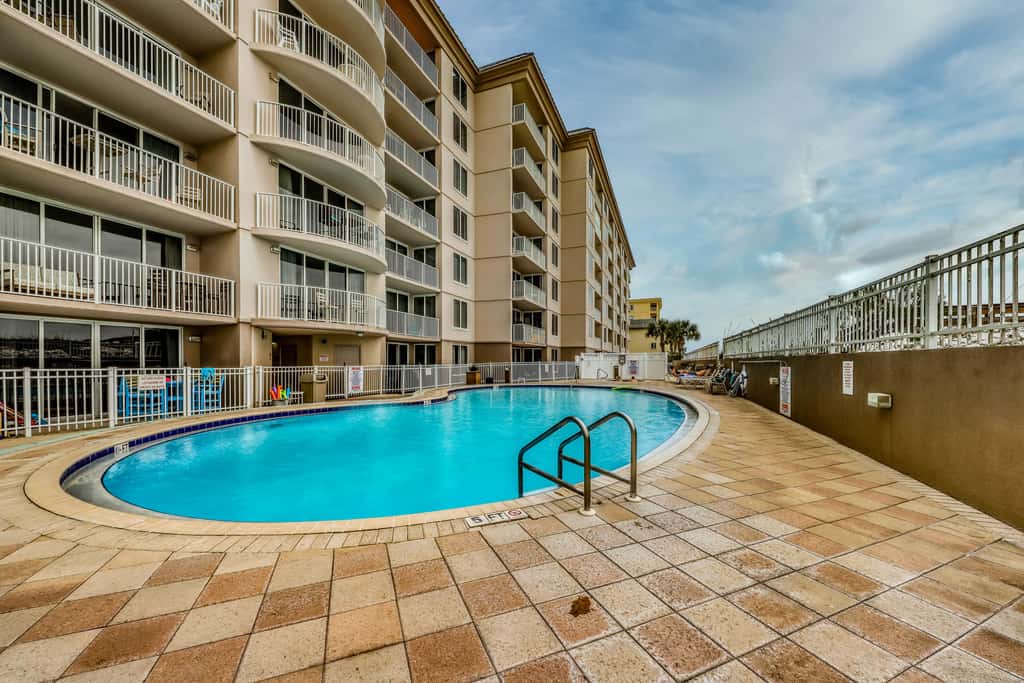 Beachfront condo with pool, hot tub, gym access, balcony