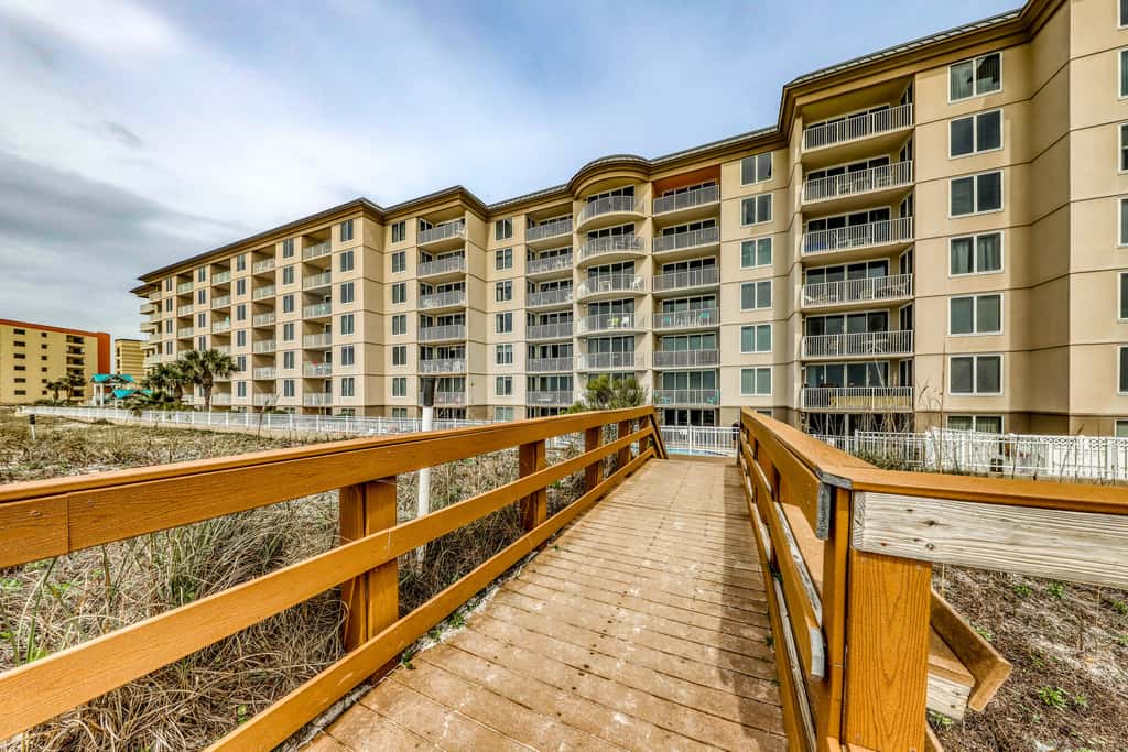 Beachfront condo with pool, hot tub, gym access, balcony
