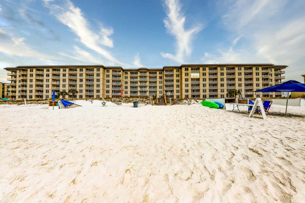 Beachfront condo with pool, hot tub, gym access, balcony