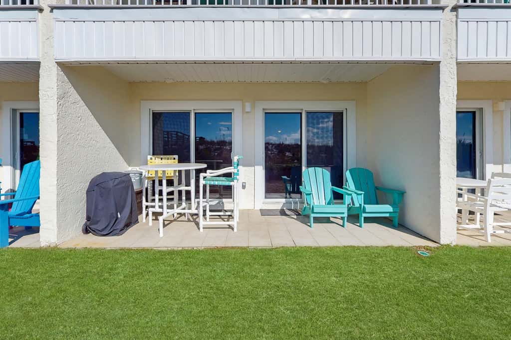 Beautiful seaside condo featuring a sparkling pool and direct beach access