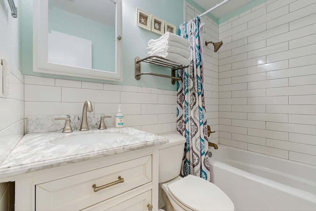 Beautiful seaside condo featuring a sparkling pool and direct beach access