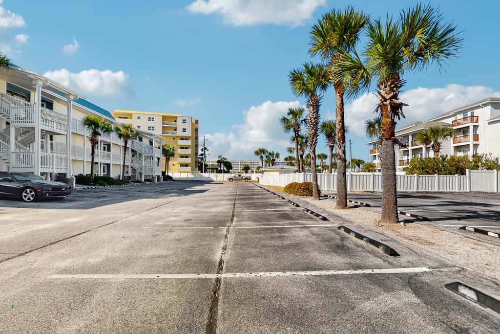 Beautiful seaside condo featuring a sparkling pool and direct beach access
