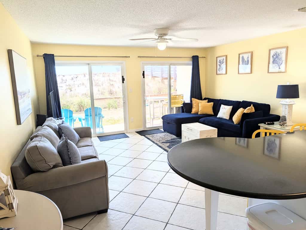 Beautiful seaside condo featuring a sparkling pool and direct beach access