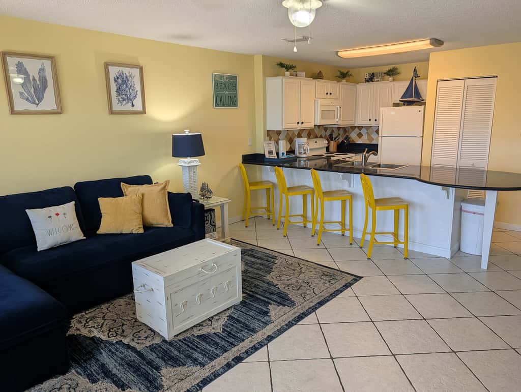 Beautiful seaside condo featuring a sparkling pool and direct beach access