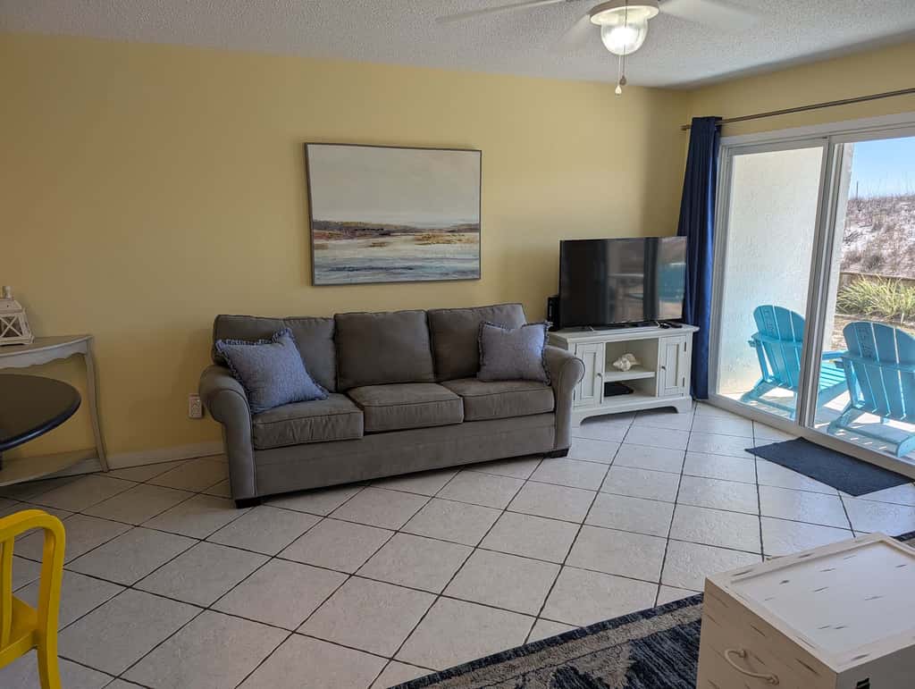 Beautiful seaside condo featuring a sparkling pool and direct beach access