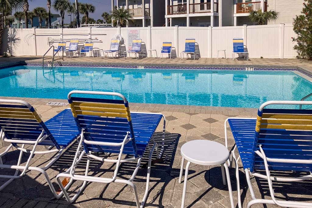 Beautiful seaside condo featuring a sparkling pool and direct beach access
