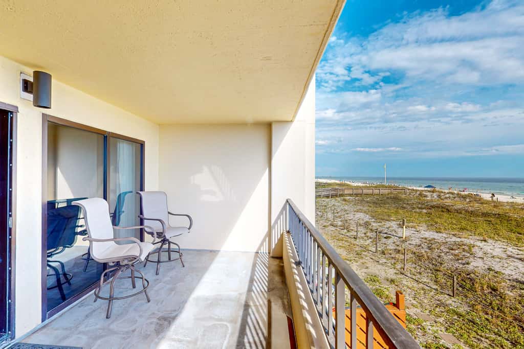 Beachfront resort condo with outdoor pool, Gulf views, balcony, W/D, & AC