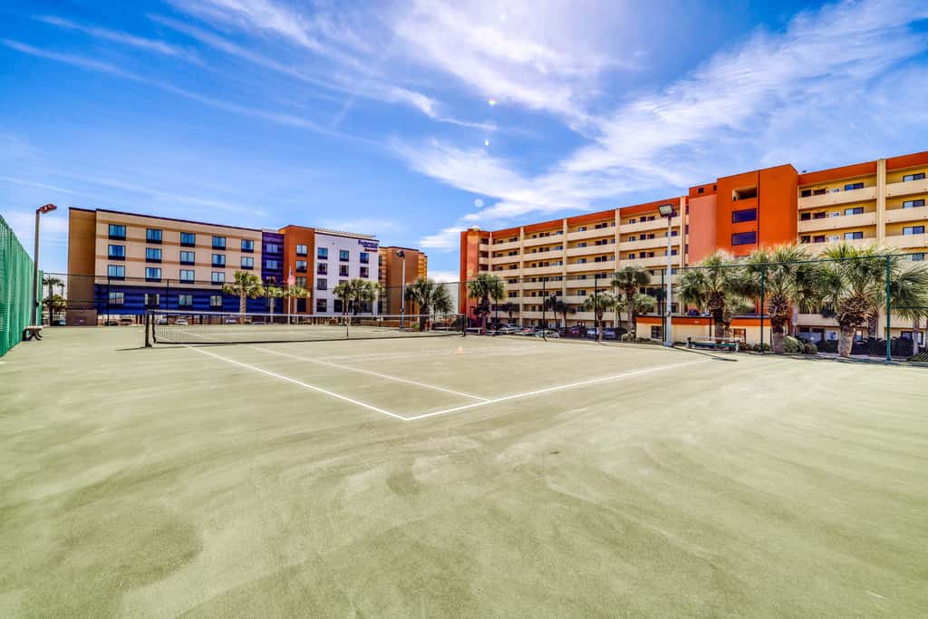 Beachfront resort condo with outdoor pool, Gulf views, balcony, W/D, & AC