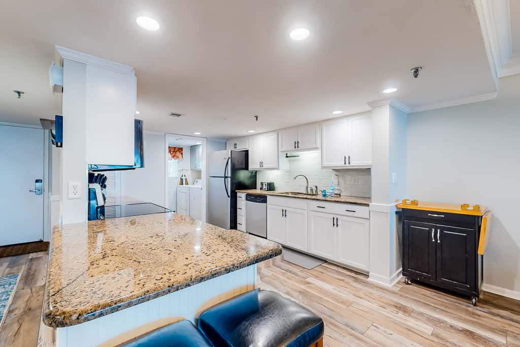 Beachfront resort condo with outdoor pool, Gulf views, balcony, W/D, & AC