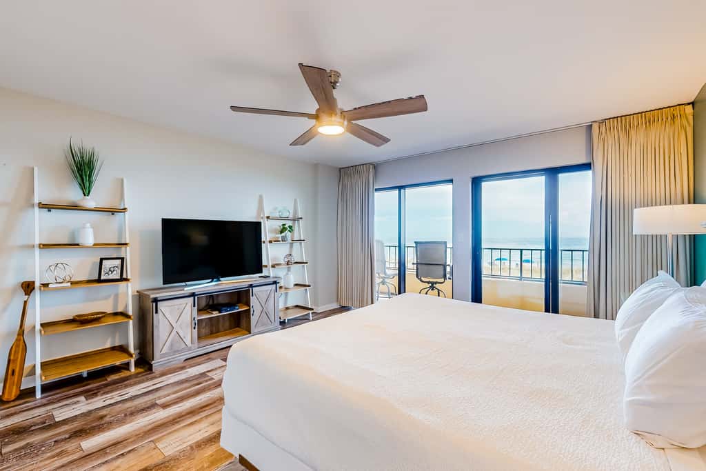 Beachfront resort condo with outdoor pool, Gulf views, balcony, W/D, & AC
