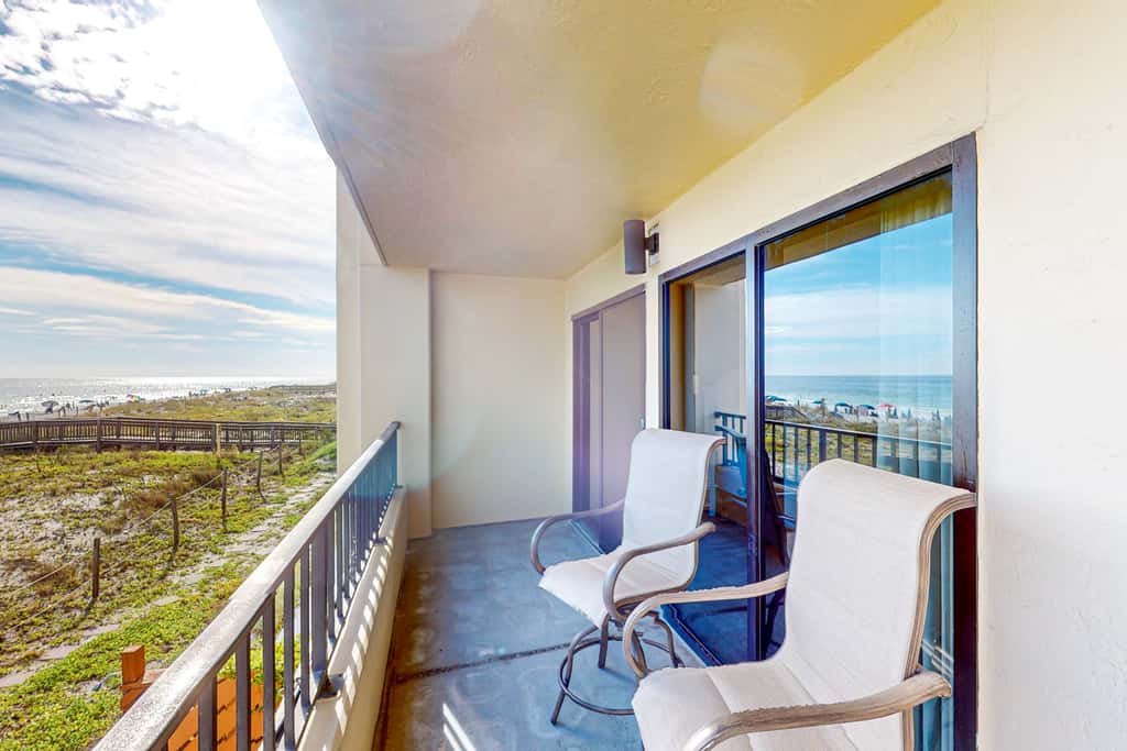 Beachfront resort condo with outdoor pool, Gulf views, balcony, W/D, & AC