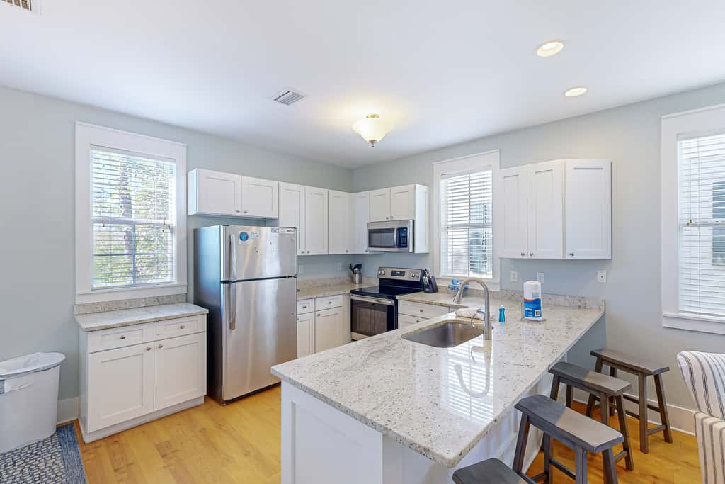 Dog-friendly 2BR home with screened porch, pool, & hot tub - beach access one mile away - snowbirds welcome