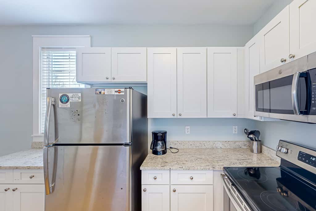 Dog-friendly 2BR home with screened porch, pool, & hot tub - beach access one mile away - snowbirds welcome