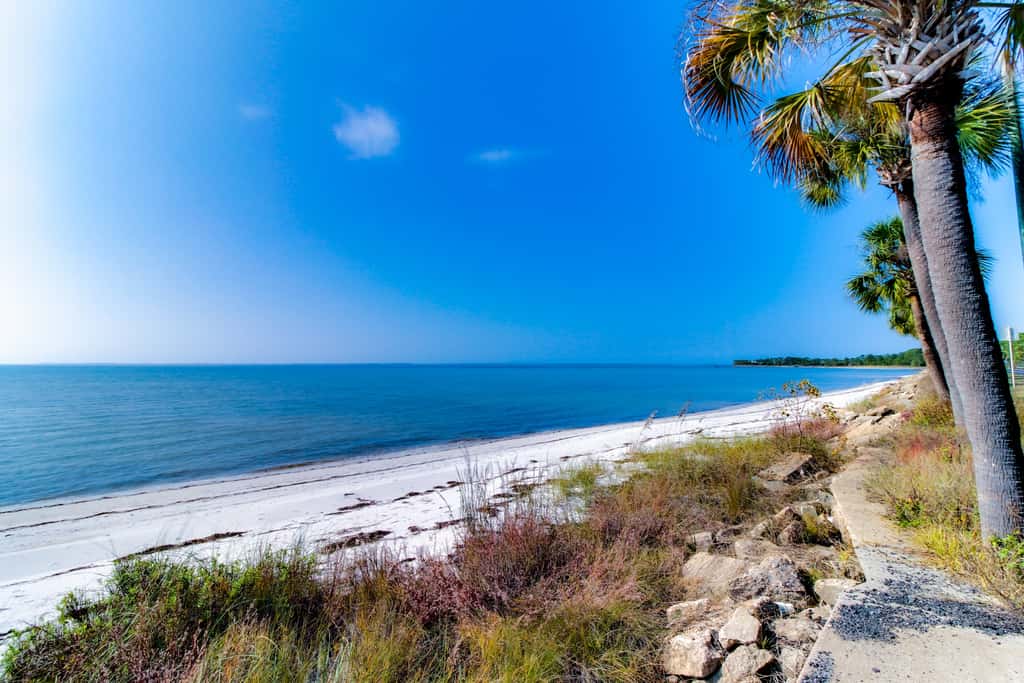 Dog-friendly 2BR home with screened porch, pool, & hot tub - beach access one mile away - snowbirds welcome