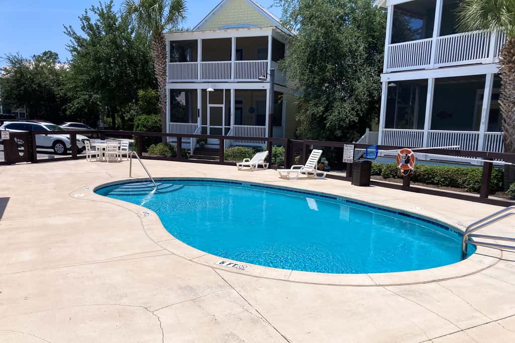 Dog-friendly 2BR home with screened porch, pool, & hot tub - beach access one mile away - snowbirds welcome