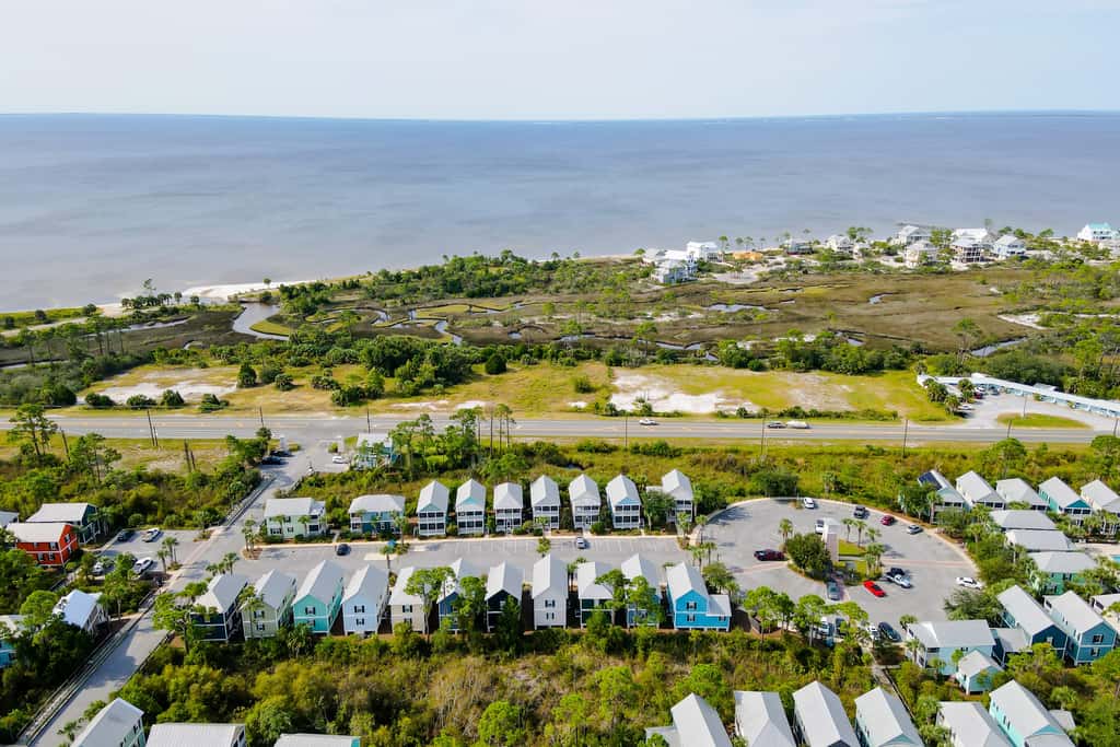 Dog-friendly 2BR home with screened porch, pool, & hot tub - beach access one mile away - snowbirds welcome