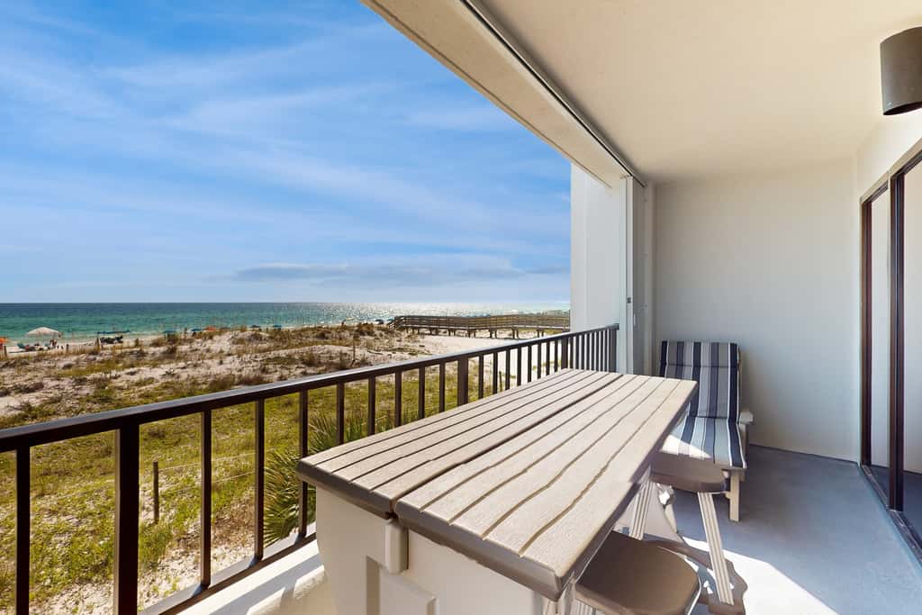 Beachfront condo with Gulf views, pool, tennis, gym, & private balcony